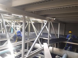 Gulf Experts employees working on Cooling Tower